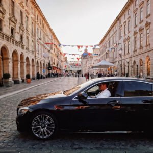 سائق عربي في أوروبا luxury-car-driver-clad-in-a-tailored-uniform-seated-behind-the-wheel-of-a-high-end-sedan-on-a-pict-445466971