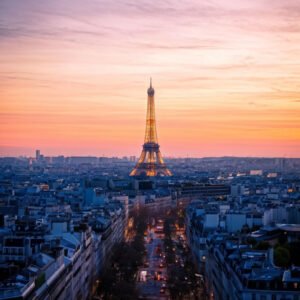سياحة فرنسا:دليلك الشامل montparnasse-tower-overshadowed-by-a-pastel-sunset-distinct-silhouette-against-the-twilight-sky-pa-683550775